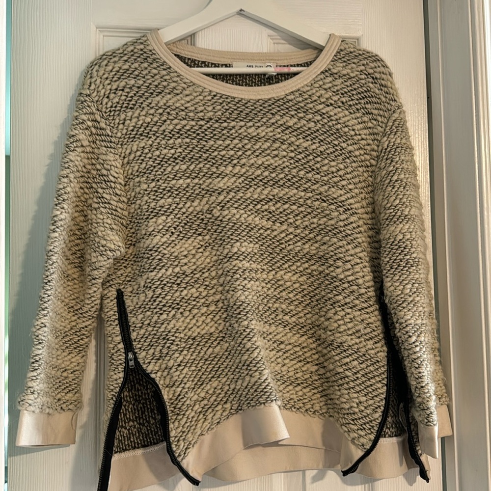 Beautiful really warm sweater with leather trim details